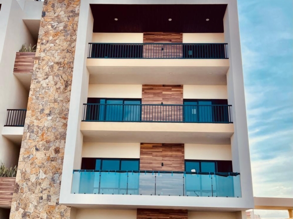 Esperanza Brisas Del Tezal Ready for immediate delivery! Beautiful ground-floor 2BR/2BA condo in Brisas del Tezal, an exclusive low-density community of only 36 residences in two 4-story elevator buildings. Just minutes from Medano Beach, downtown Cabo, shopping, golf, and restaurants. Features premium finishes including marble floors, granite countertops, parota wood carpentry, floor-to-ceiling marble showers, pantry, laundry room, wall-to-wall closets, mini-split A/C throughout, and a spacious terrace. No adjoining side neighbors for exceptional privacy. Resort-style amenities include a heated pool, clubhouse, coworking space with Wi-Fi, BBQ area, playground, landscaped grounds, 24/7 security, and immediate occupancy. Ideal for full-time living, vacation use, or investment. – 2 bedroom Ground-Floor Close to the Pool, Cabo Corridor, BS