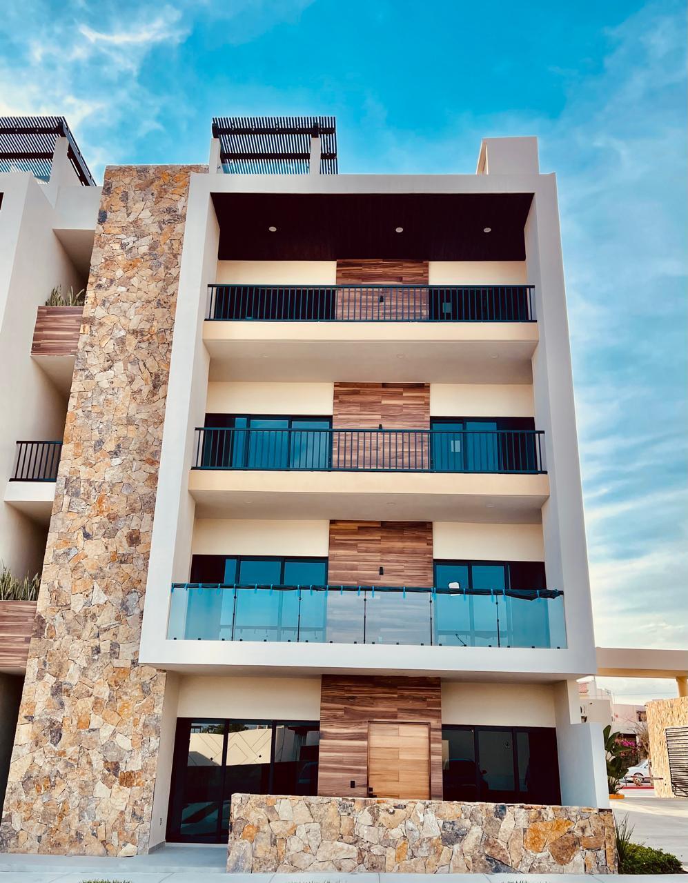 Esperanza Brisas Del Tezal Ready for immediate delivery! Beautiful ground-floor 2BR/2BA condo in Brisas del Tezal, an exclusive low-density community of only 36 residences in two 4-story elevator buildings. Just minutes from Medano Beach, downtown Cabo, shopping, golf, and restaurants. Features premium finishes including marble floors, granite countertops, parota wood carpentry, floor-to-ceiling marble showers, pantry, laundry room, wall-to-wall closets, mini-split A/C throughout, and a spacious terrace. No adjoining side neighbors for exceptional privacy. Resort-style amenities include a heated pool, clubhouse, coworking space with Wi-Fi, BBQ area, playground, landscaped grounds, 24/7 security, and immediate occupancy. Ideal for full-time living, vacation use, or investment. for sale